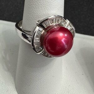 925 Silver Red Pearl  Ring Accented w/ CZ Baguettes surrounding the Pearl Top.